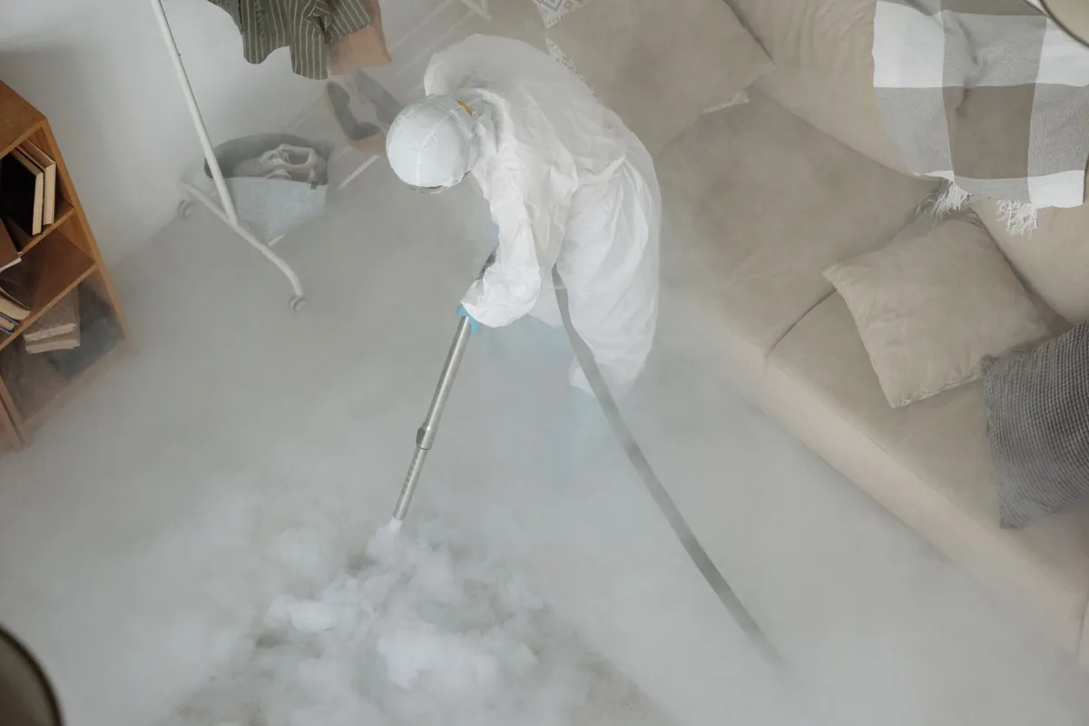 Biohazard cleanup technician in protective equipment, Salt Lake City, UT